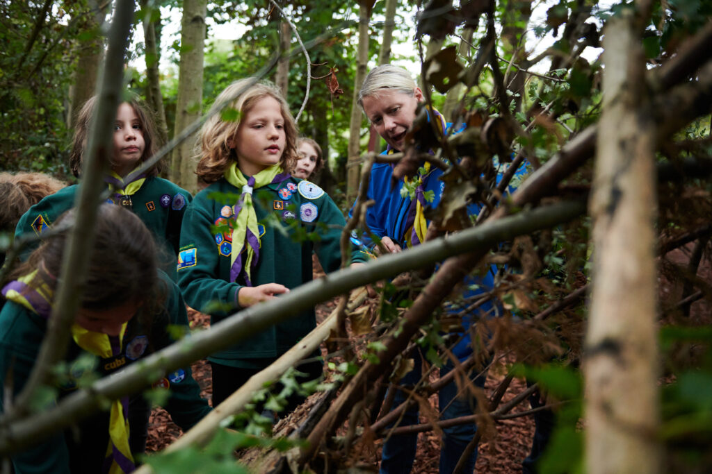 A Scout leader helping at a session